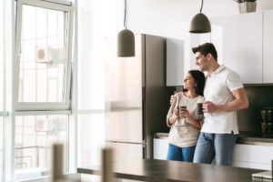 young couple holding cups