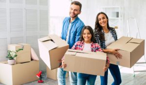 family holding boxes